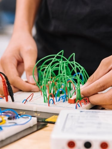 One person works with cables.